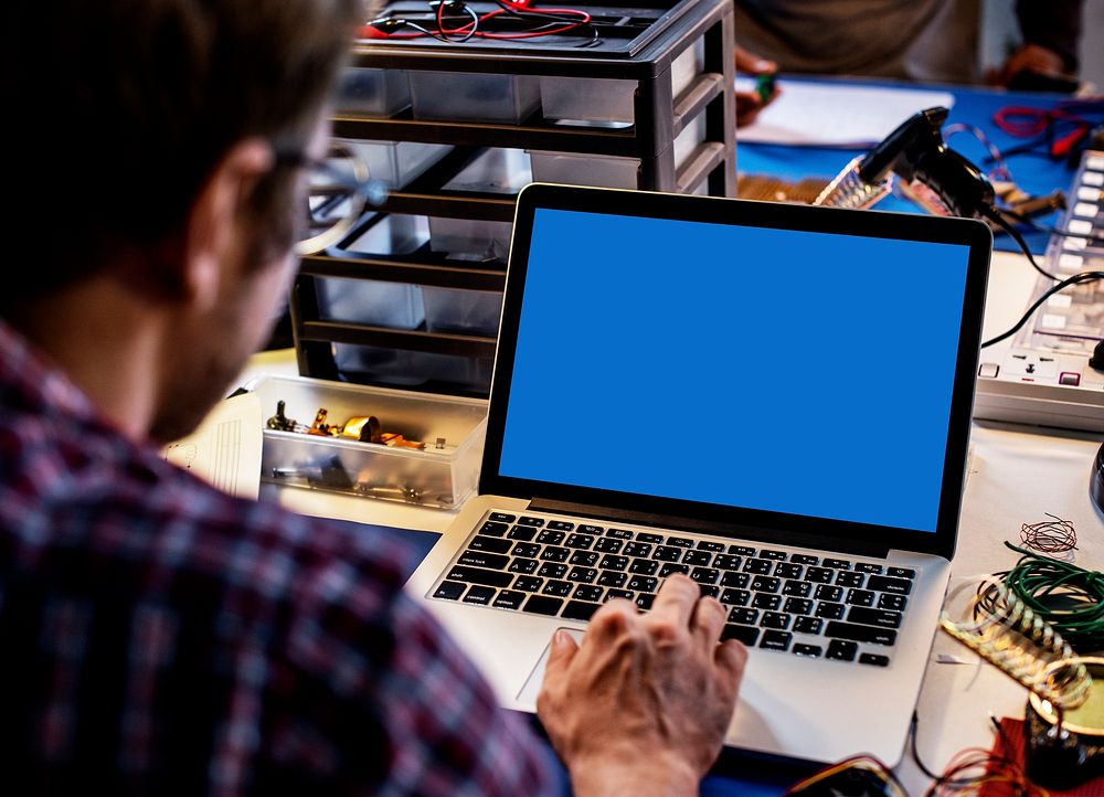 Computer laptop showing blank blue screen