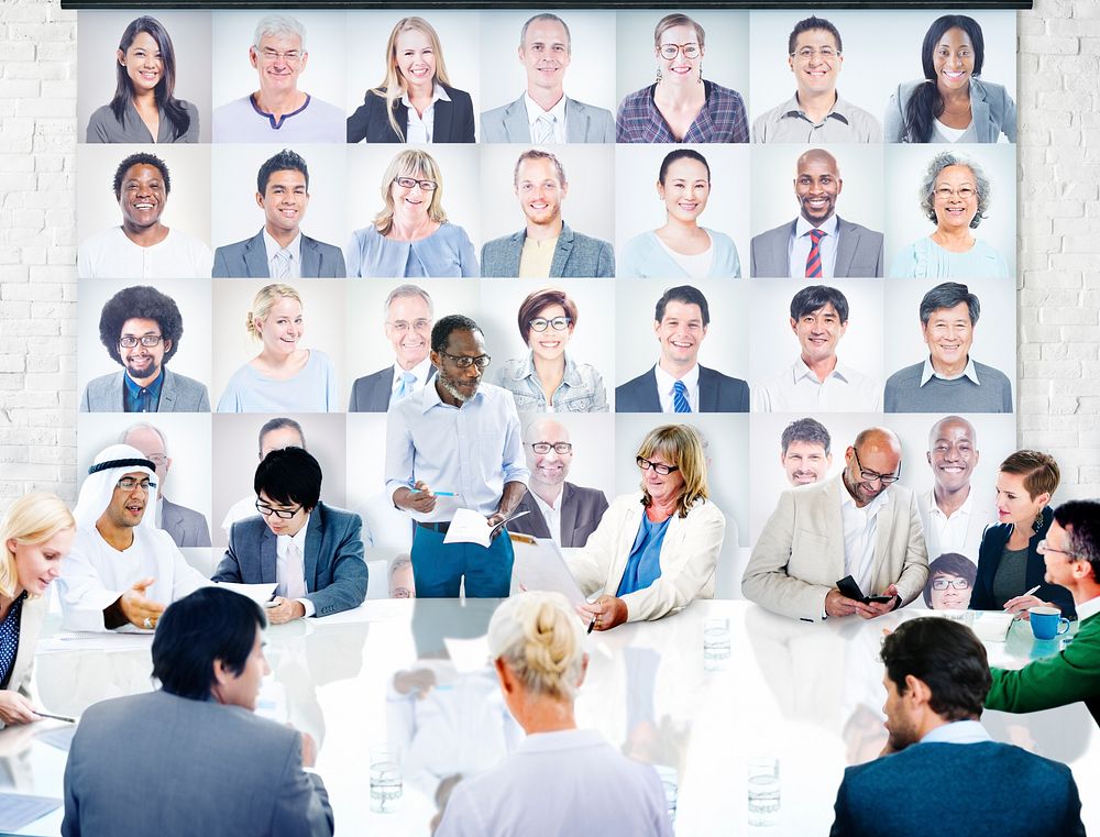 Diverse Business People in a Meeting with People's Portraits