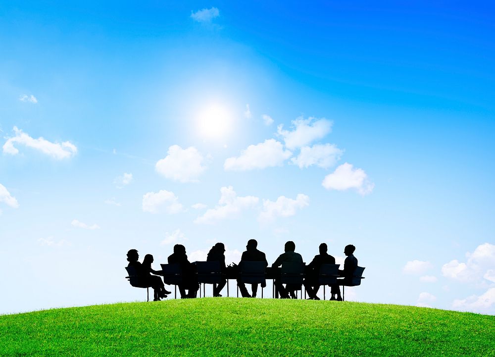 Group of business people having an outdoor meeting.
