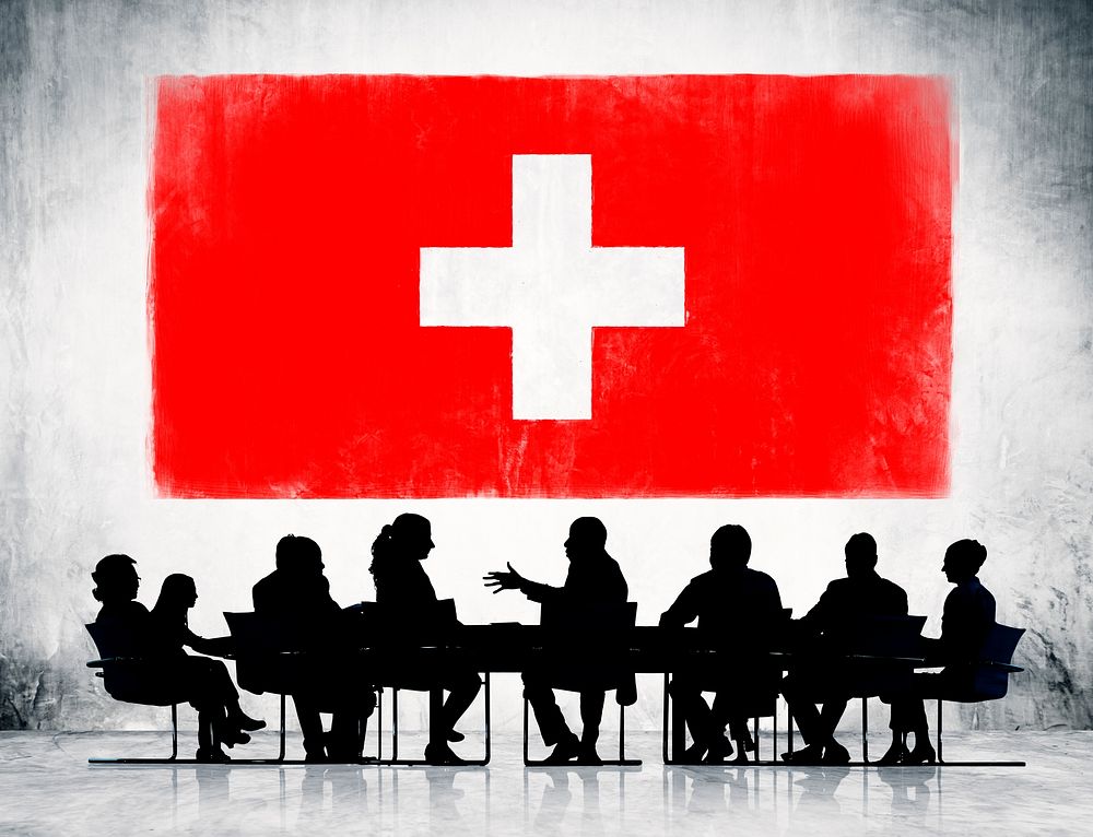 Switzerland flag and a group of business people.