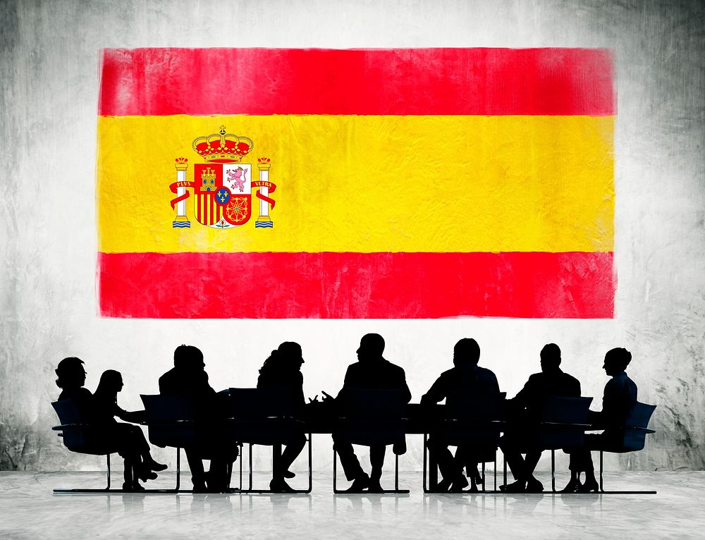 Group of Corporate People Having a Meeting Regarding the National Issues of Spain