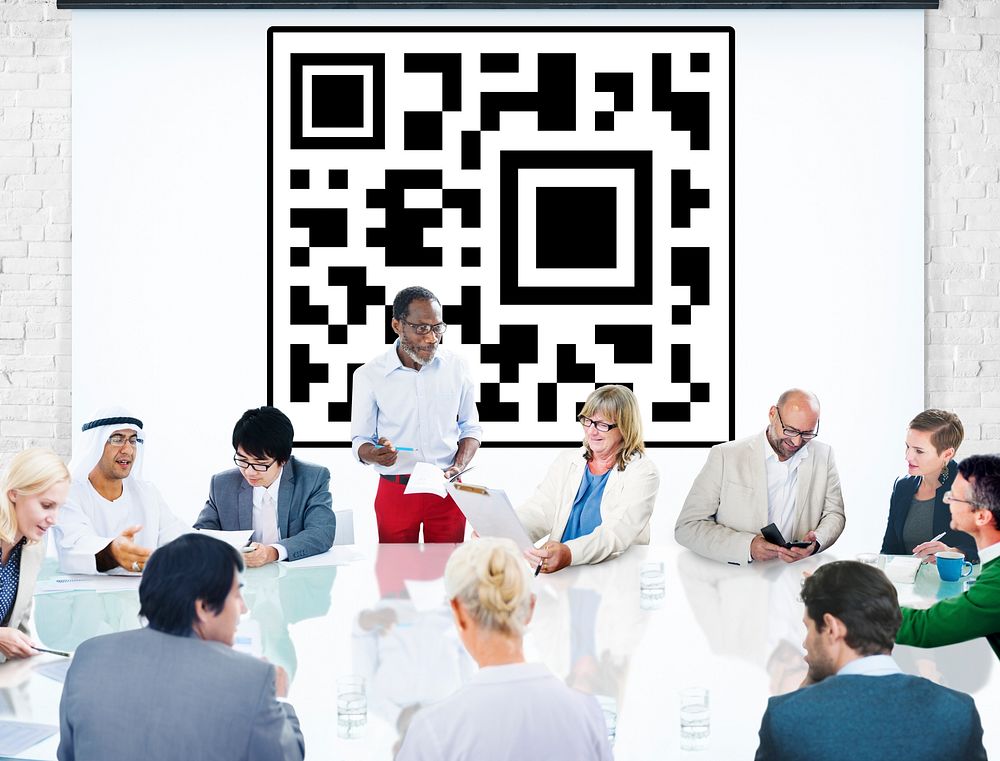 Business people in a meeting with QR code in the background