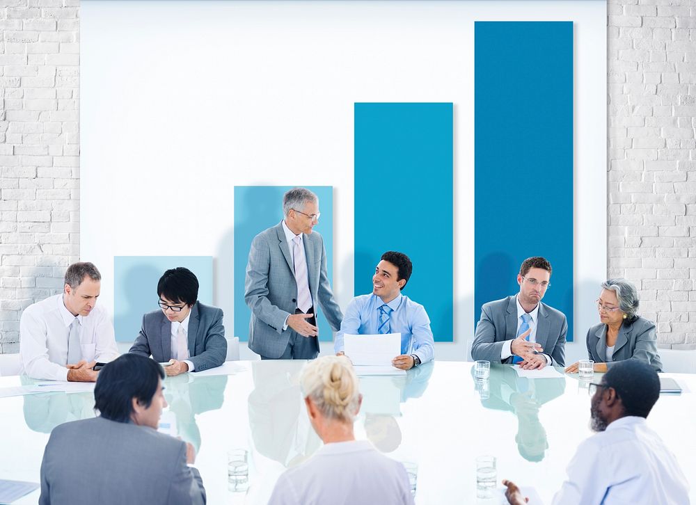 Group of Business People Meeting with Chart