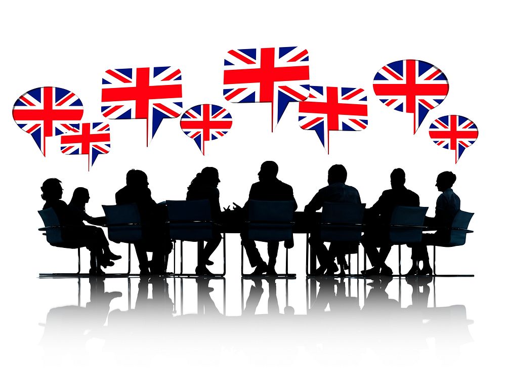 Talking Business People Silhouettes Isolated On White With British Flag Speech Bubble