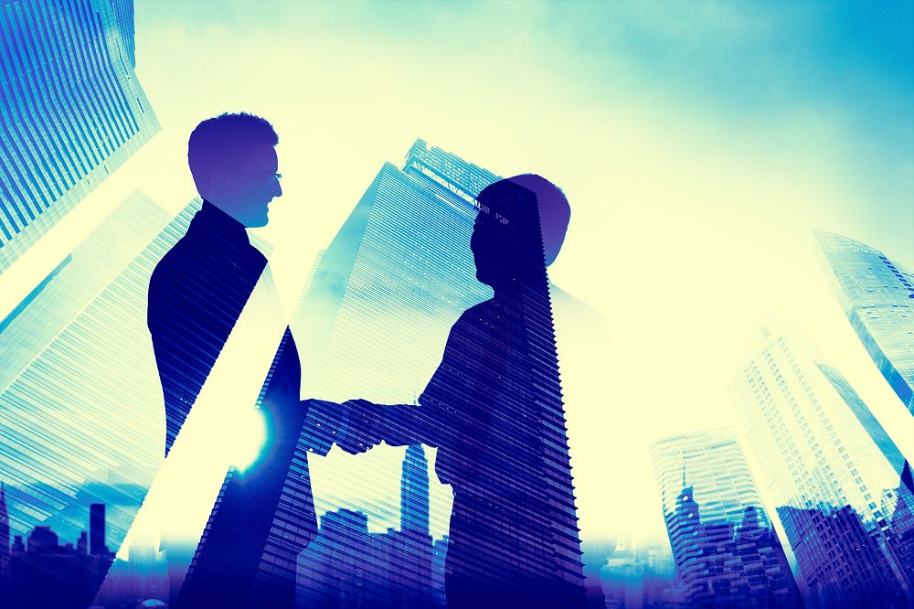 Businessmen Handshake Agreement City Concept