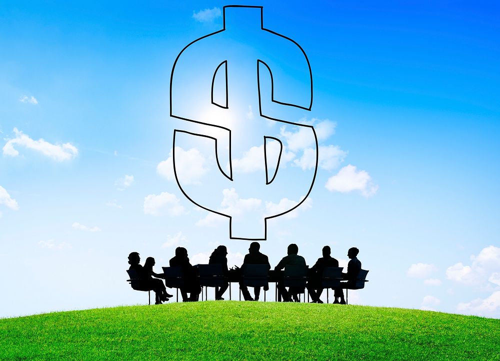 Dollar sign and silhouette of business people at a meeting table