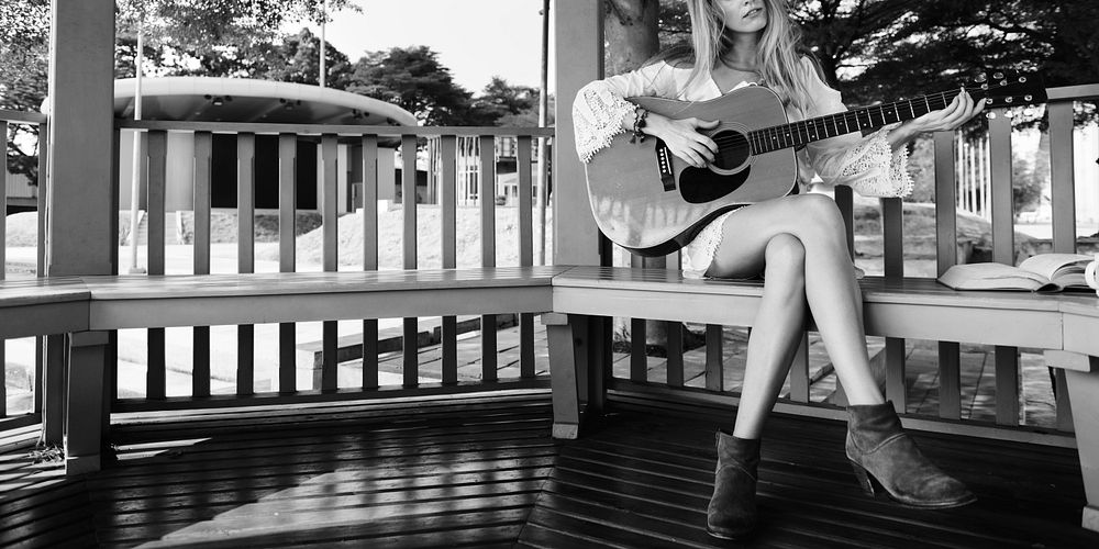 Beautiful country girl with her guitar
