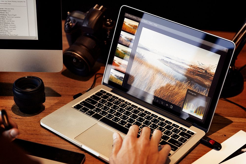 A man editing photos on a acomputer