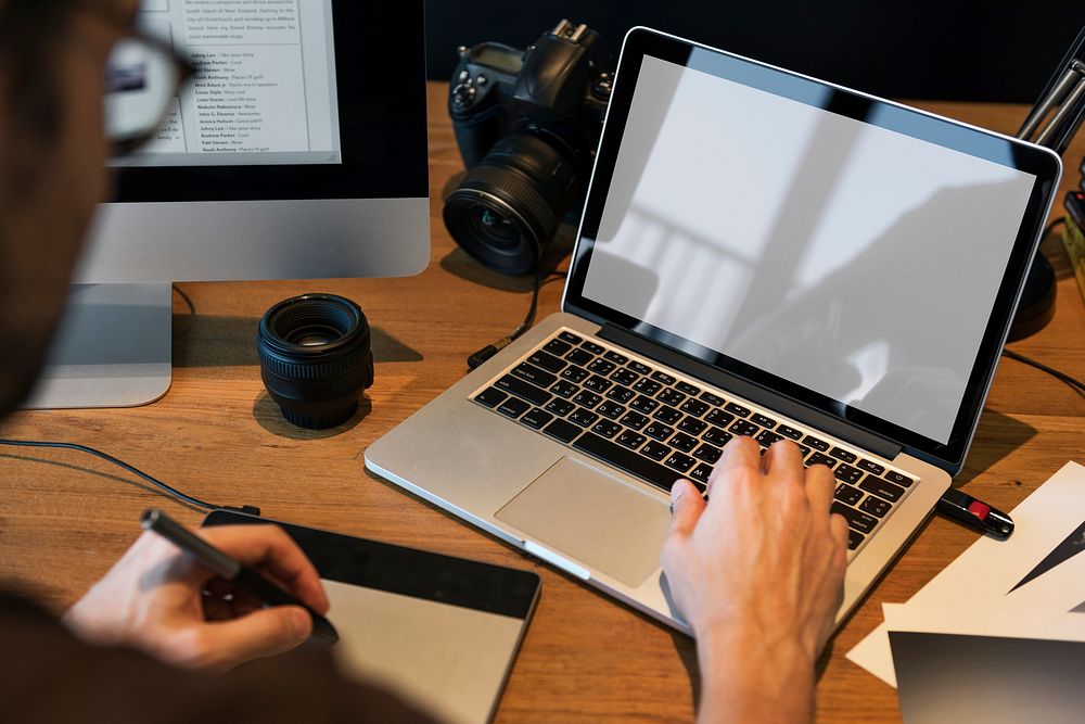 A man editing photos on a acomputer