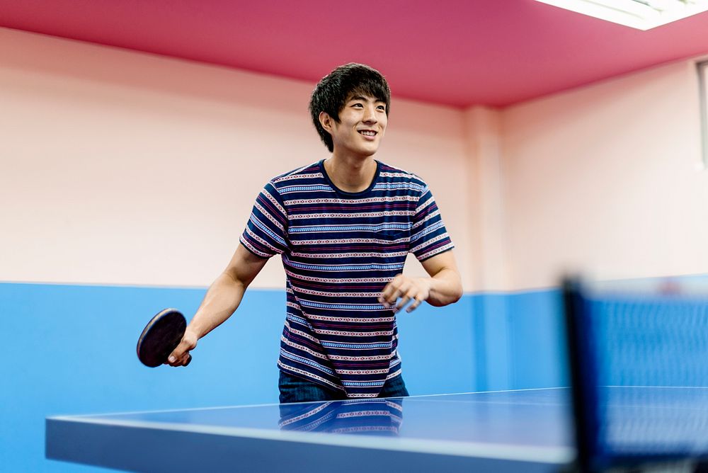 Asian guy playing table tennis