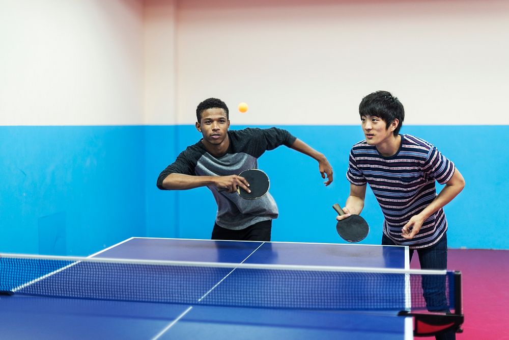 Friends playing table tennis