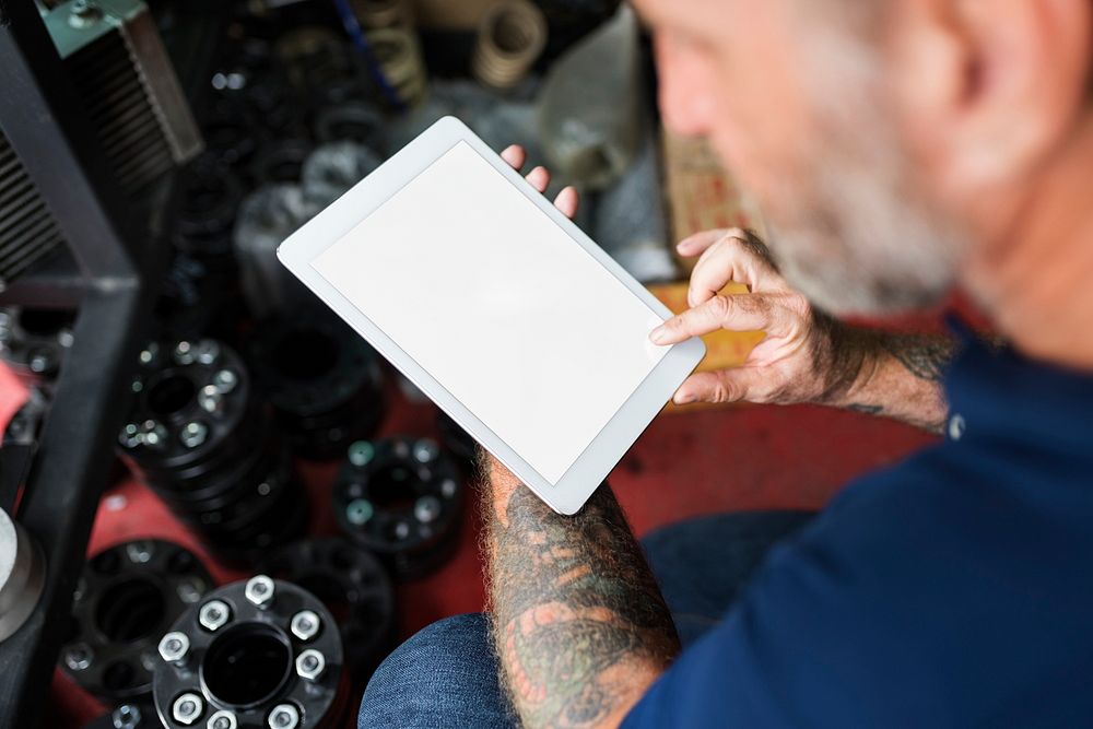 Auto Repair Shop Owner Checking Tablet Concept