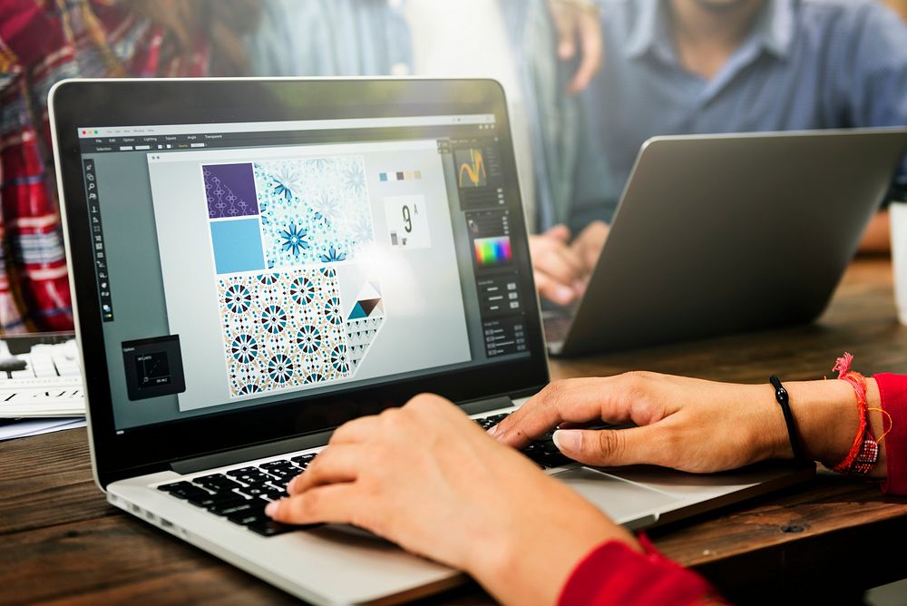 Group of Indian people are using computer laptop