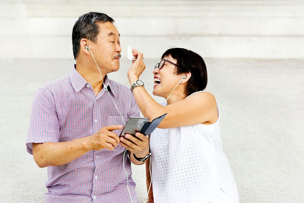 Senior Asian Couple Standing Playful Concept