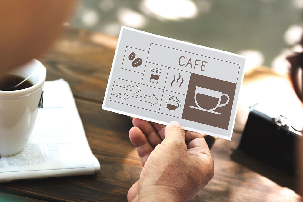 Man drinking coffee with Illustration of coffee shop advertisement on flyer
