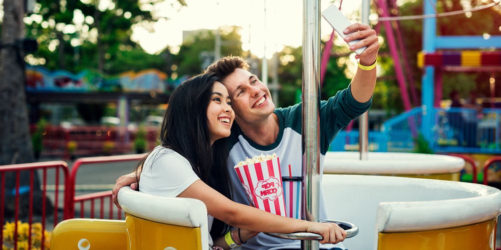 Couple Dating Amusement Park Enjoyment Hugging Concept