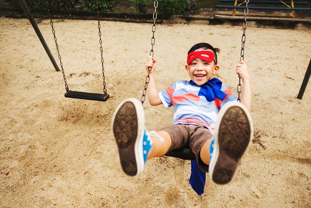 Little boy on the swings