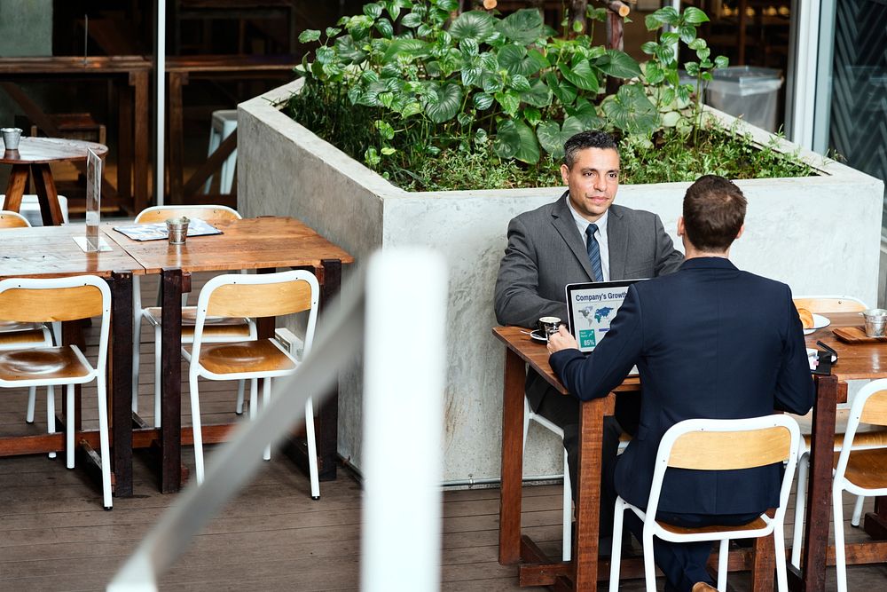 Two Businessmen Cafe Meeting Laptop Concept