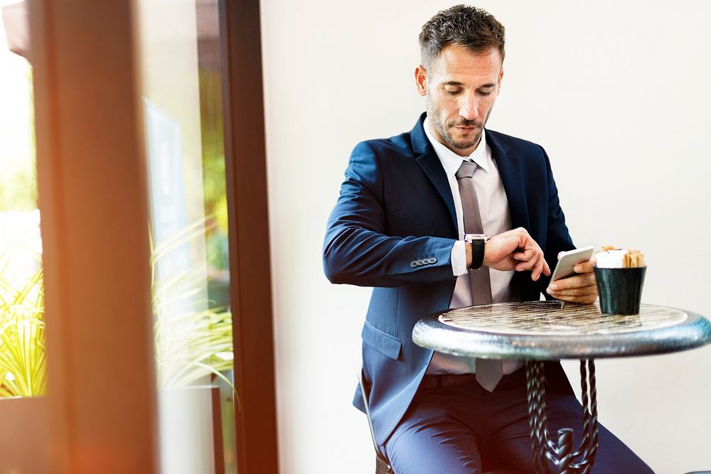 Businessman Checking Time Watch Concept