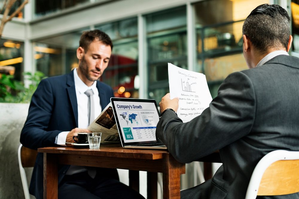 Businessmen Working Cafe Laptop Paperwork Concept