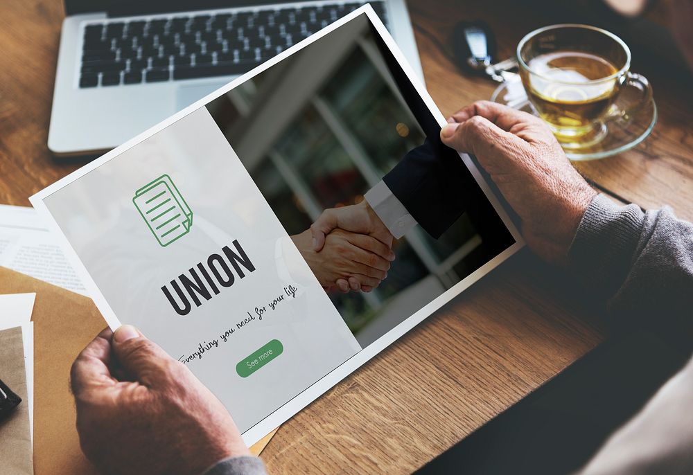 Union word on business handshake background