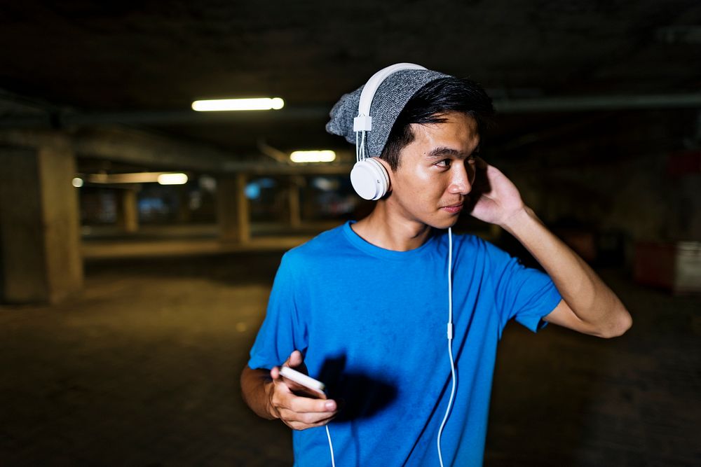 Young guy listening to music