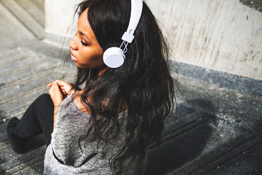 African American woman is listening to music