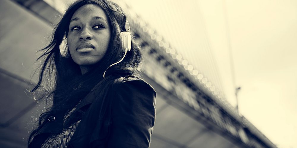African American woman is listening to music