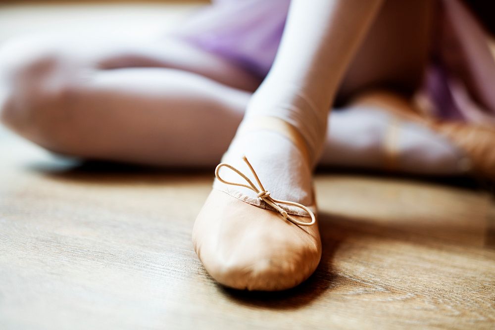 A closeup of a girl's ballet shoe
