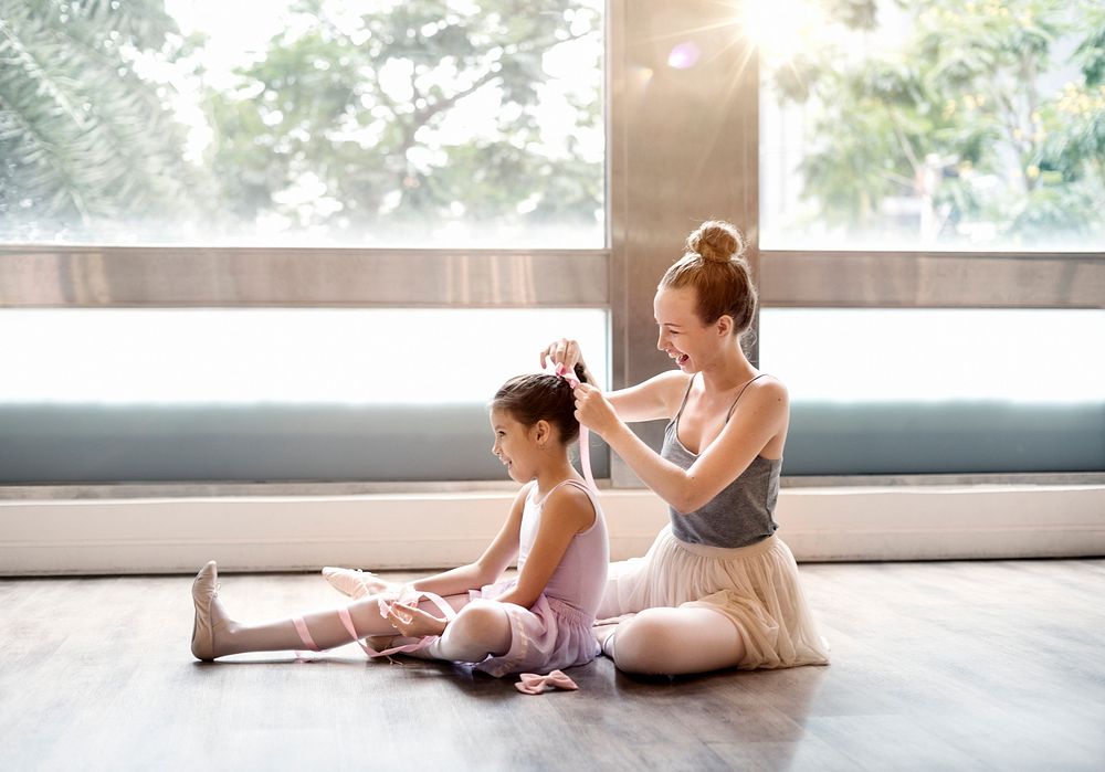 Girl ballerina with her teacher