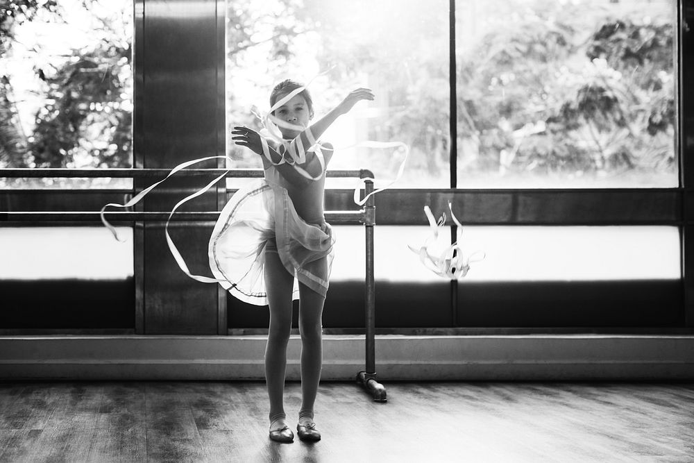 Young ballerina girl with the ribbons