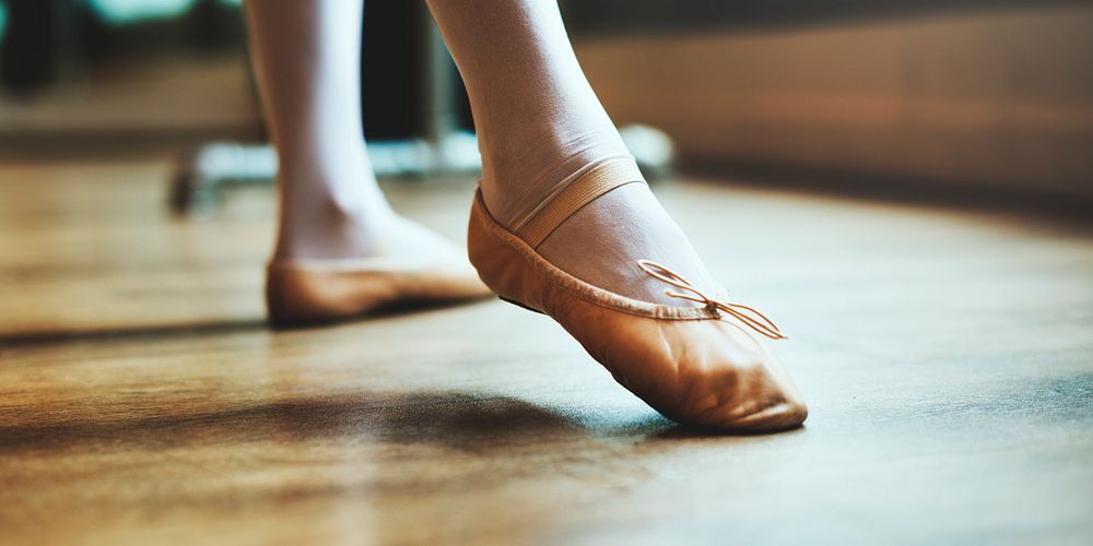 Young ballerina's feet wearing ballet shoes