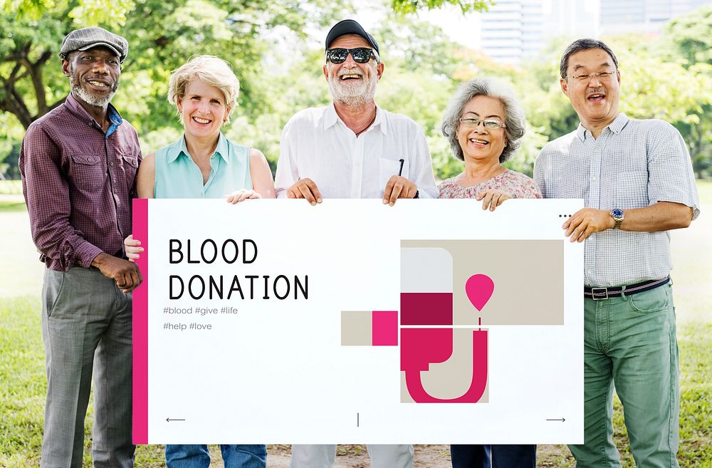 Group of senior adult holding banner of blood donation campaign
