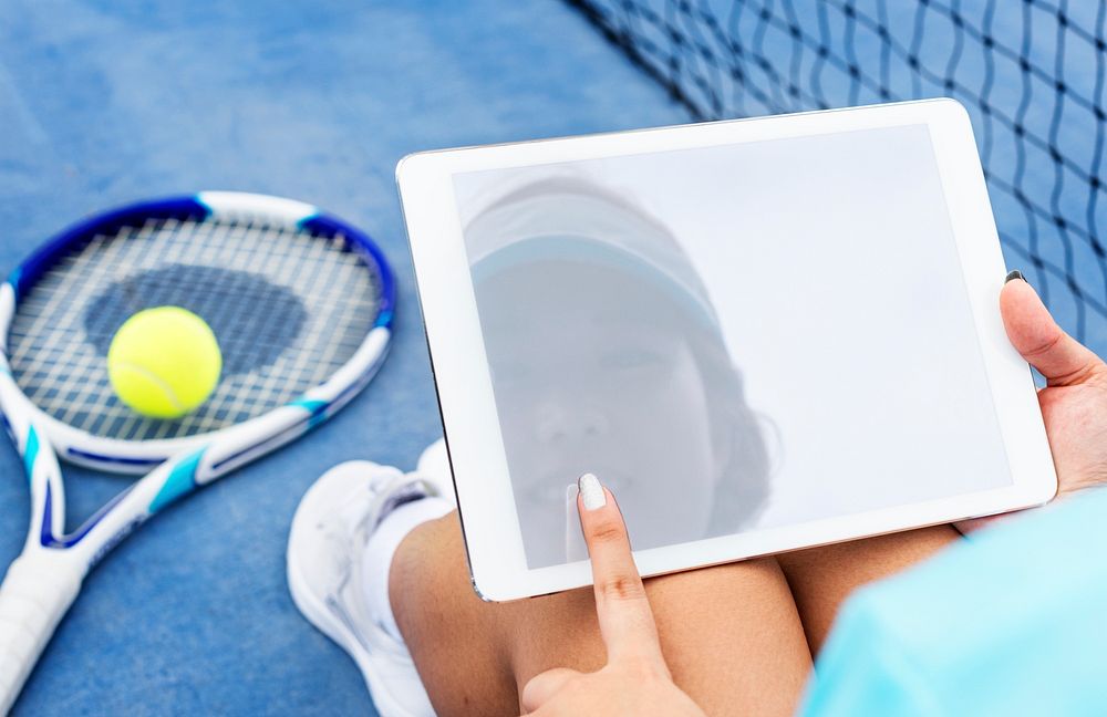 Reflection of a female tennis player on tablet screen mockup