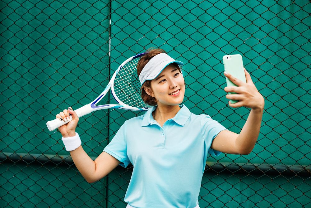 Asian Woman Using Digital Smart Phone Selfie Concept