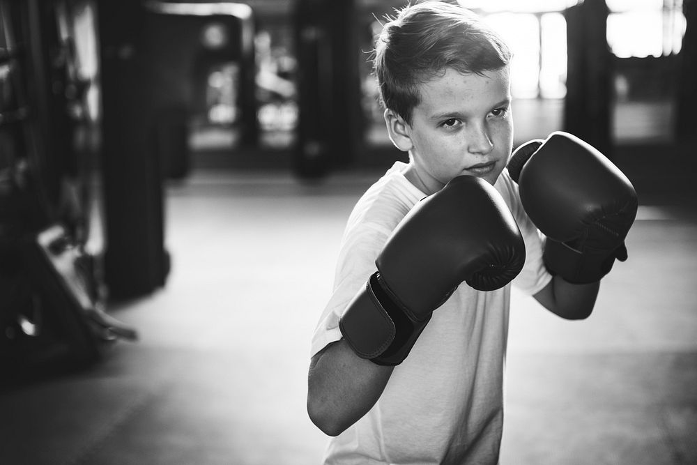 Boy Boxing Training Punching Bag Exercise Concept