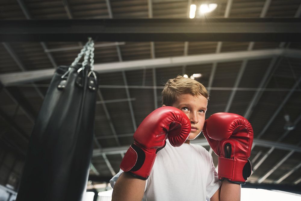 Boy Boxing Training Punching Bag Exercise Concept