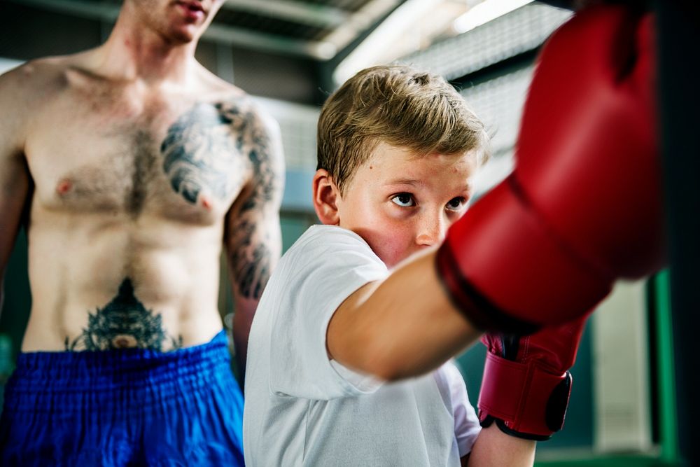 Young boy aspiring to become a boxer