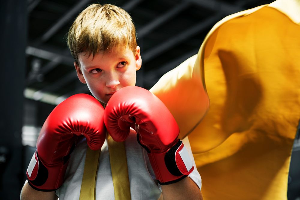 Young boy aspiring to become a boxer