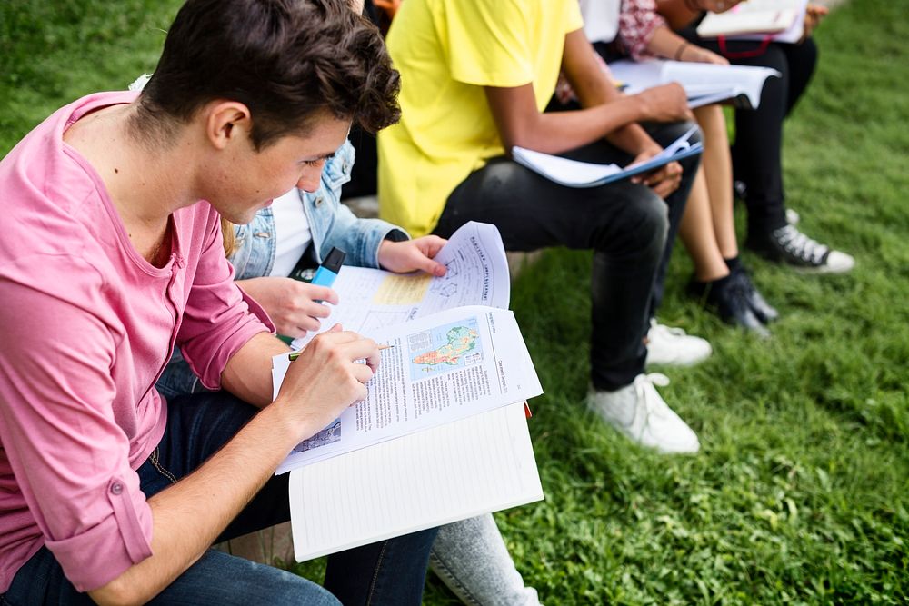 Students doing homework in the park