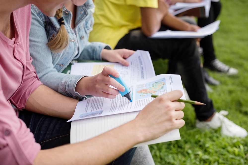 Young Diverse Group Studying Outdoors Concept