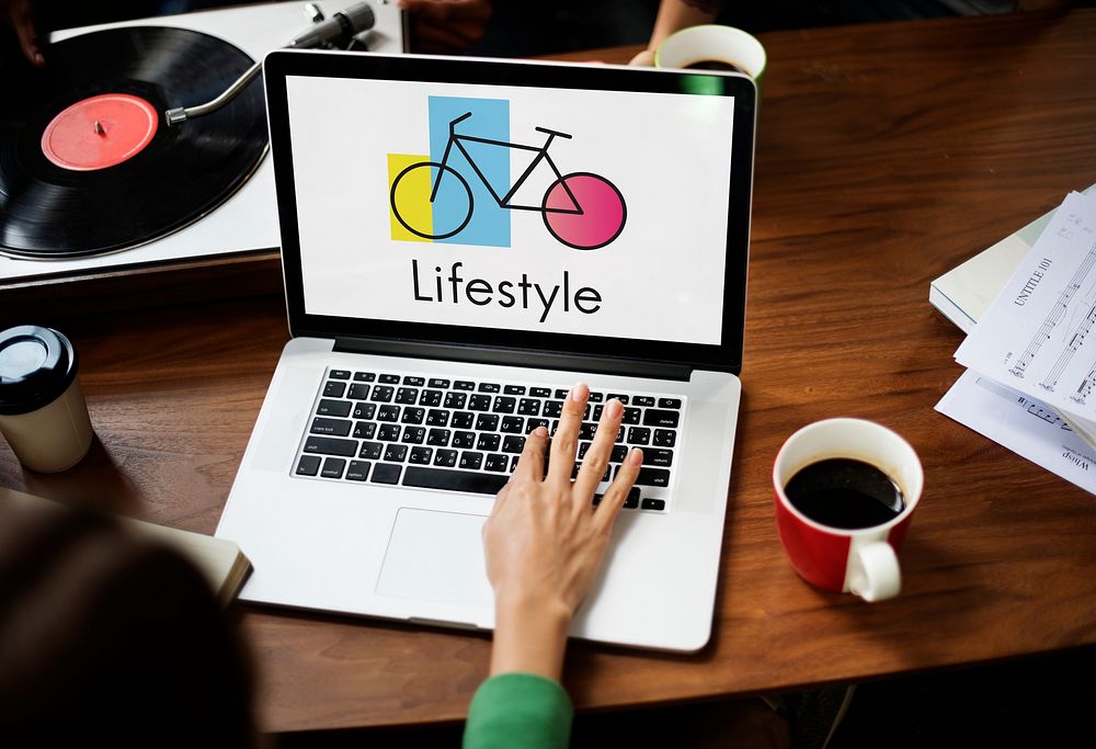 Woman Using Laptop Wprking with Bike Icon on the Screen