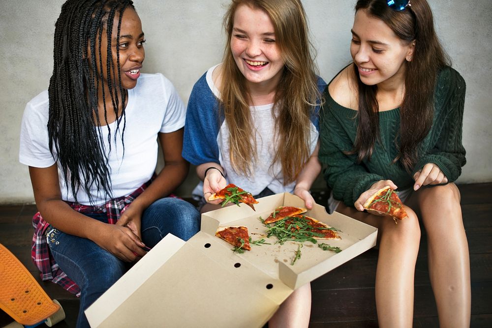 Friends sharing a pizza