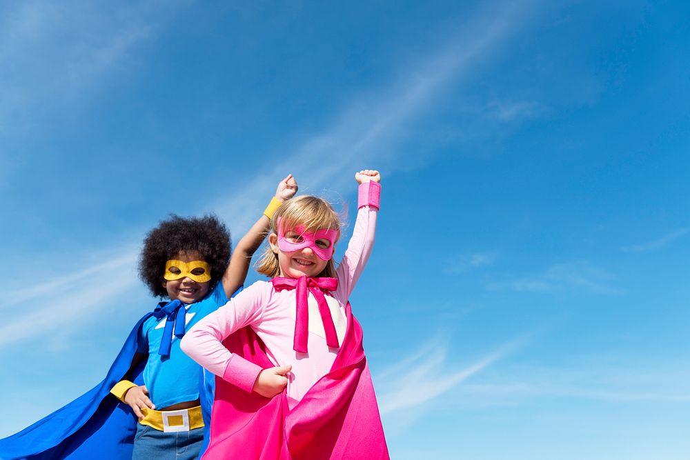 Two girls playing superheroes