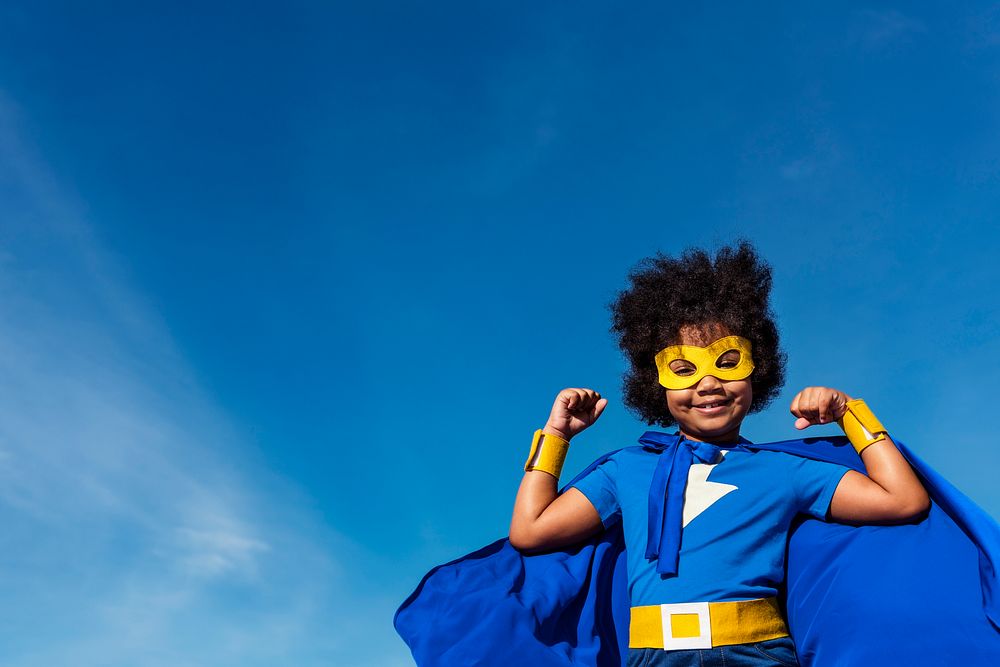 Cute little superhero girl with afro