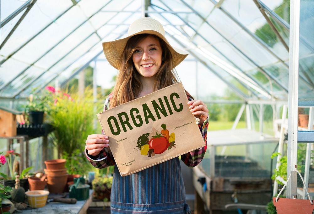 Young woman showing organic poster