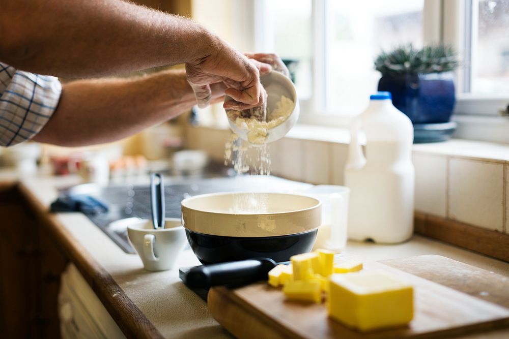 Caucasian man baking scones at home