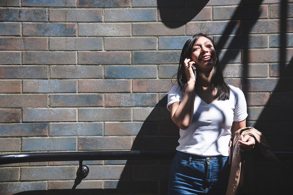 Beautiful asian woman on the phone