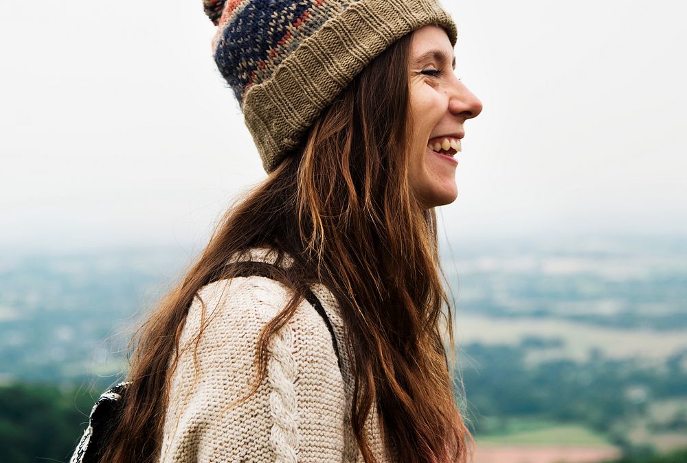 Side view of smiling woman enjoying the nature