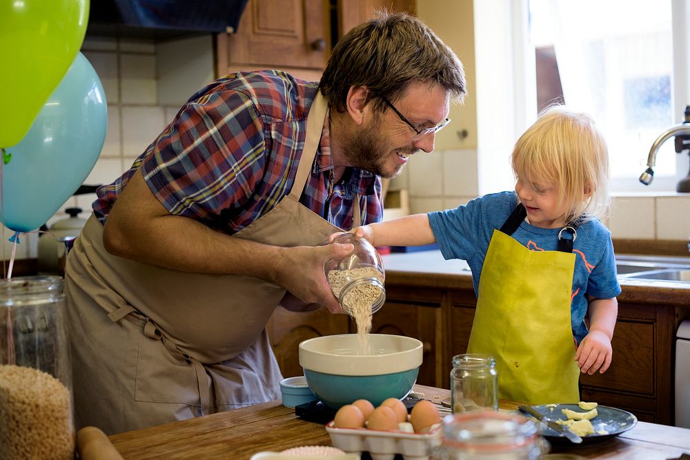 Kid baking with dad